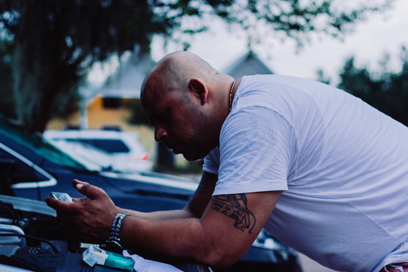 leisure activity, mode of transportation, mid adult men, vehicle, bald, mid adult, brawny, day, outdoors, adult, focus on foreground, land vehicle, young adult