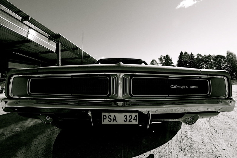 land vehicle, no people, clear sky, built structure, day, number, outdoors, nature, western script, Dodge, plant, retro styled, tree, sky, car, Dodge Charger