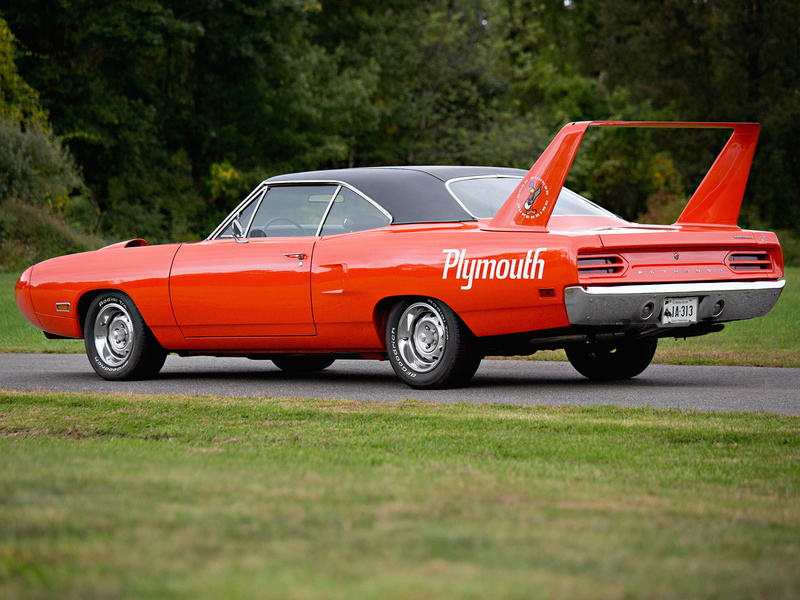 motor vehicle, road, selective focus, car, transportation, side view, plant, orange color, Superbird, green color, communication, outdoors, muscle car