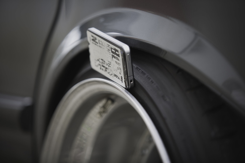 motion, land vehicle, focus on foreground, machinery, communication, selective focus, single object, motor vehicle, technology, transportation, text, no people