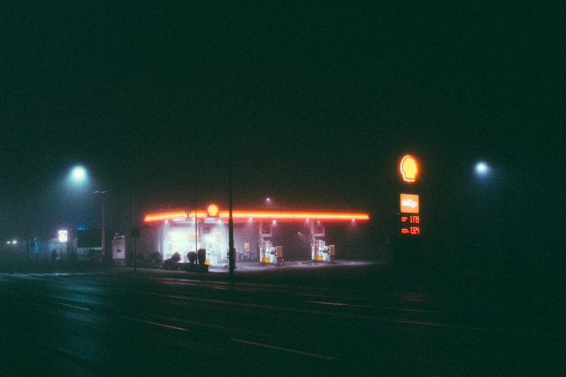 misty, street, built structure, fog, evening, gas station, sky, architecture, mode of transportation, dark, no people, outdoors, transportation system