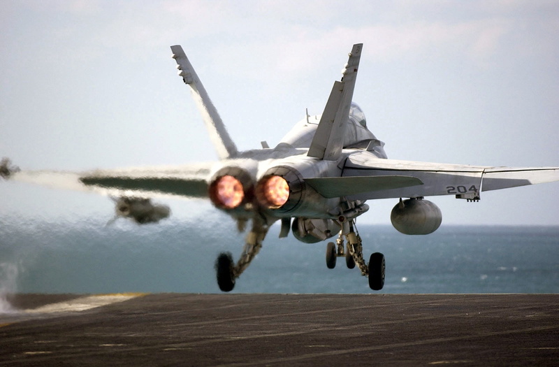 mid-air, air vehicle, catapult, fighter, water, military training, mode of transportation, single object, flight deck, launch, motion, f-18, sky, ship