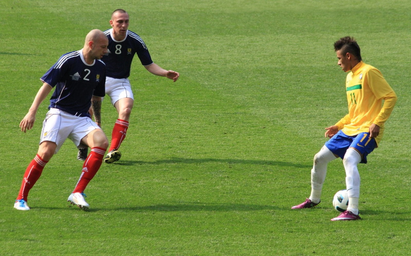Soccer, two people, motion, team sport, offense - sporting position, grass, conflict, full length, challenge, sports uniform, athlete, effort, day, people