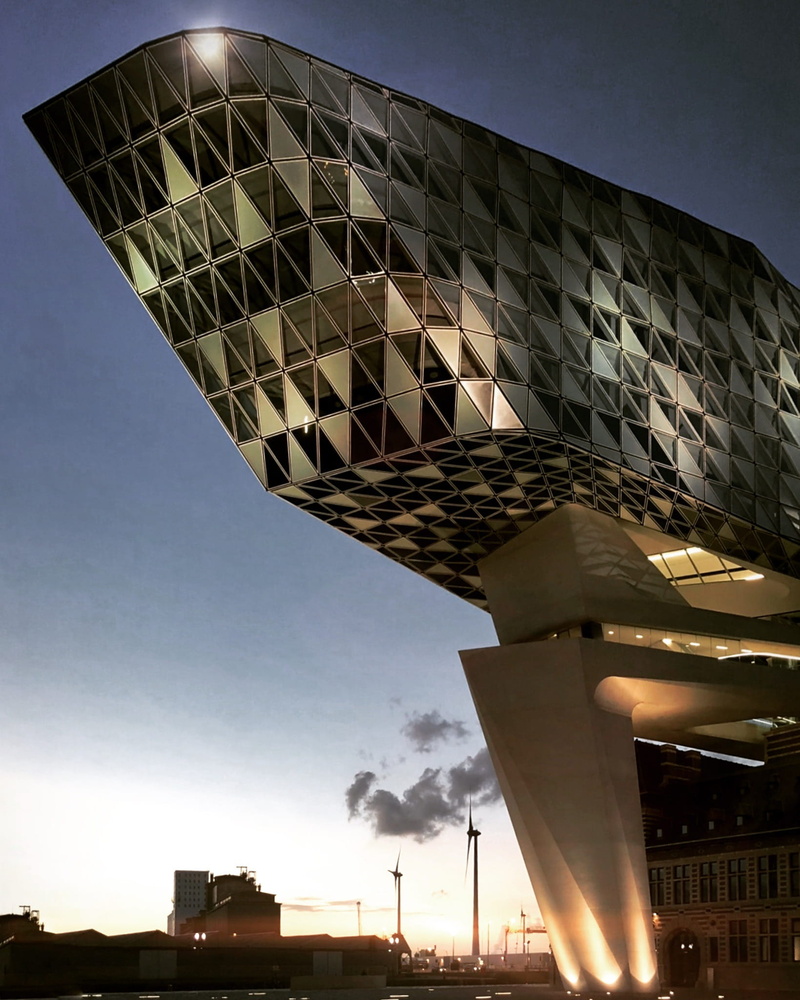 antwerp, zaha hadid, low angle view, sky, building, city, building exterior, office building exterior, skyscraper, sunset, illuminated, dusk, lighting equipment