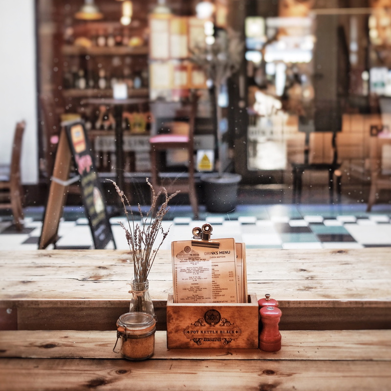 brown, indoors, 2K, no people, tight, top, air, surface, street, transparent, building, close-up, wooden, beside, architecture, shakers, condiments, restaurant