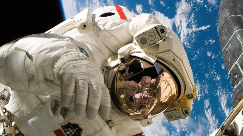 earth, reflection, astronaut, no people, sunlight, nature, blue, outdoors, sky, low angle view, space exploration, human representation, iss, transportation
