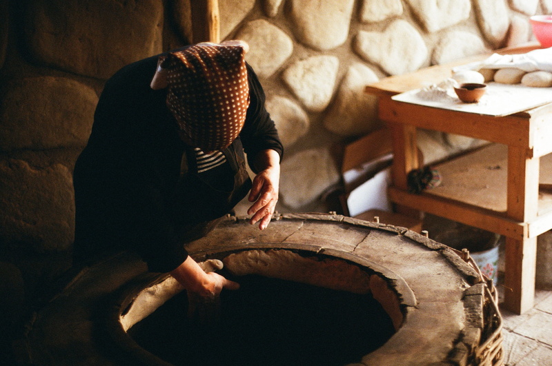 human body part, well, indoors, georgia, elderly woman, lifestyles, street food, hat, business, skill, young adult, relaxation, rock pattern, clothing