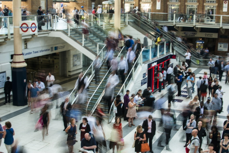 train station, blurred motion, commuters, city street, outdoors, built structure, real people, architecture, crowded, mode of transportation, group of people