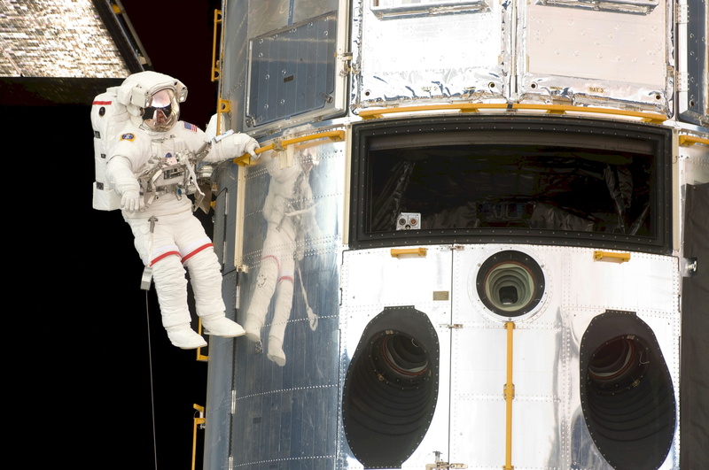 tools, mode of transportation, glass - material, pack, art and craft, suit, human representation, spacewalk, space shuttle, occupation, nature, travel