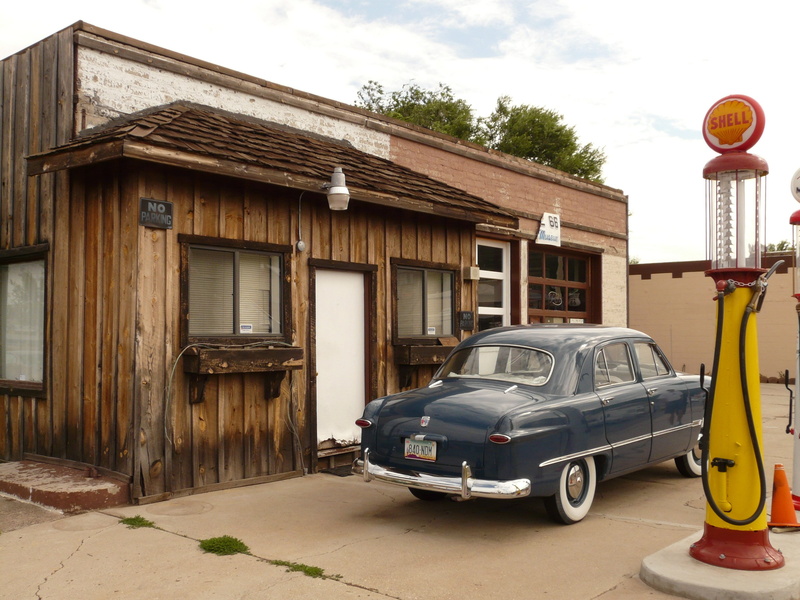refuel, daytime, car, house, built structure, scooter, shell, parked, land vehicle, petrol stations, road, parking, petrol, motor vehicle, nature, garage