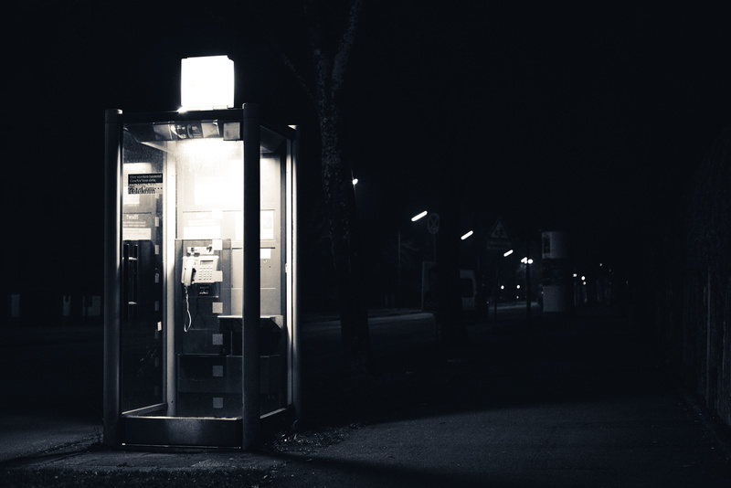 building exterior, communication, black and white, street, booth, Night, fuel pump, built structure, entrance, telephone booth, monochrome, no people, dark