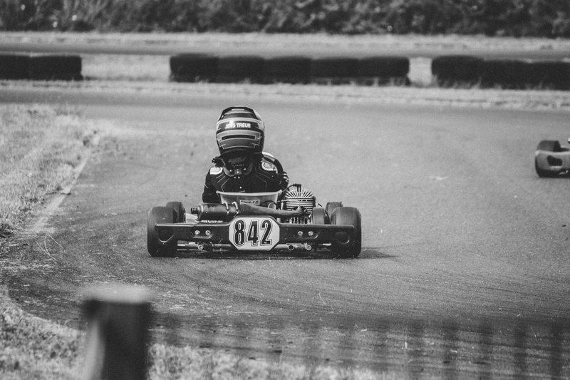 focus on foreground, 842, high angle view, number, man, competition, riding, monochrome, sport, selective focus, vehicle, kcnn, track, speed, car, racing