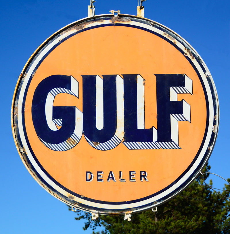 capital letter, low angle view, fuel, gulf oil sign, blue, road sign, aged, old, information, no people, outdoors, rough, retro, close-up, guidance, information sign