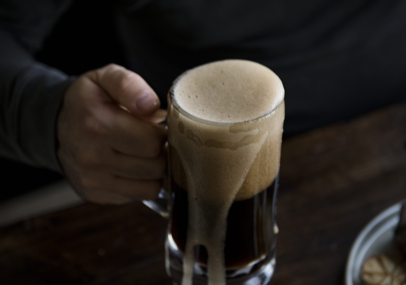 alcohol, foam, person, mug, coffee - drink, refreshment, happy hour, one person, beverage, coffee, wood, cup, frothy drink, adult, alcoholic beverages