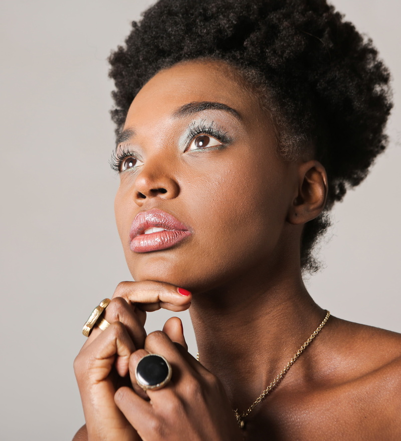 black eyes, woman, wearing, headshot, gem stones, ethnic, portrait, pose, nail, curly hair, holding, studio shot, black, 25-30 year old, fashion, hair