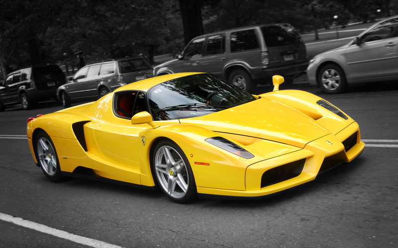 yellow taxi, 1080P, selective coloring, close-up, parking, city, no people, sign, car, outdoors, land vehicle, transportation, road, Enzo Ferrari, yellow cars