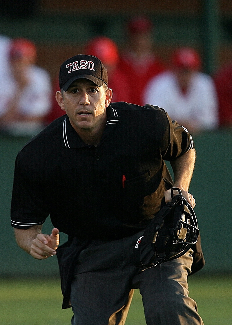 incidental people, people, baseball, game, serious, mid adult men, three quarter length, young adult, looking away, one person, day, focus, uniform, cap