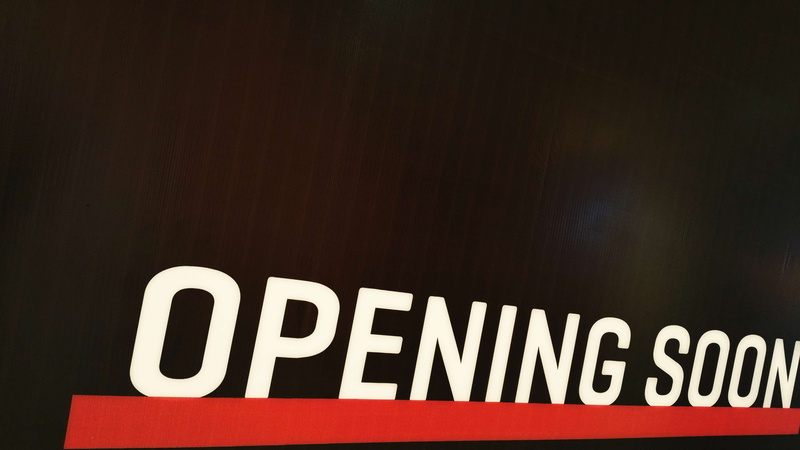 black color, red, advertisements, air freshener, billboard, wall - building feature, capital letter, indoors, coming up, close-up, advertisement, billboards
