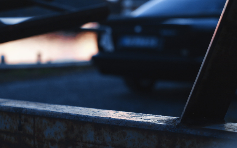 focus on foreground, transportation, BMW, selective focus, mode of transportation, illuminated, no people, sunset, motor vehicle, close-up, BMW E34, communication
