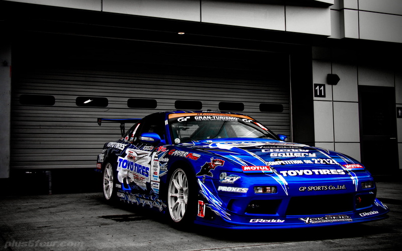 motor racing track, blue cars, western script, transportation, 1080P, mode of transportation, tuning, illuminated, no people, car, Nissan, communication