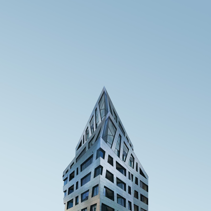 clear sky, office building exterior, day, geometric shape, architectural, outdoors, built structure, windows, modern, structure, window, low angle view