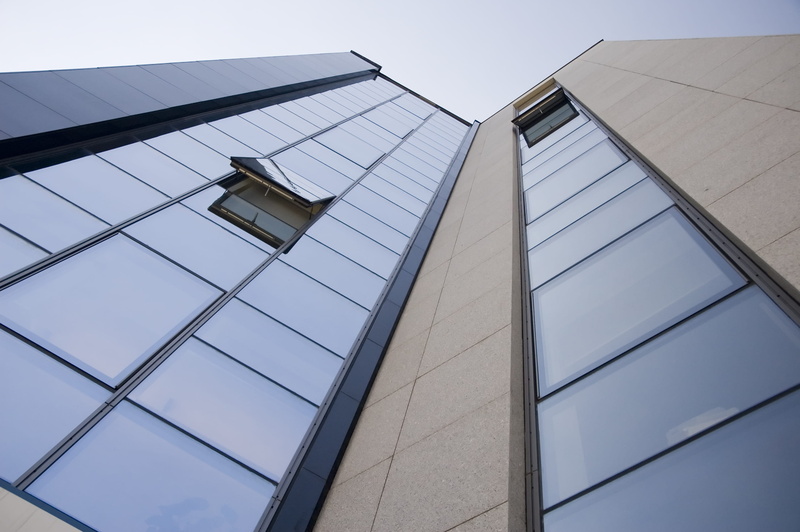 tower, building exterior, glass windows, built structure, clear sky, building, office, contemporary, day, sky, gray, angle, futuristic, tall - high, low angle view