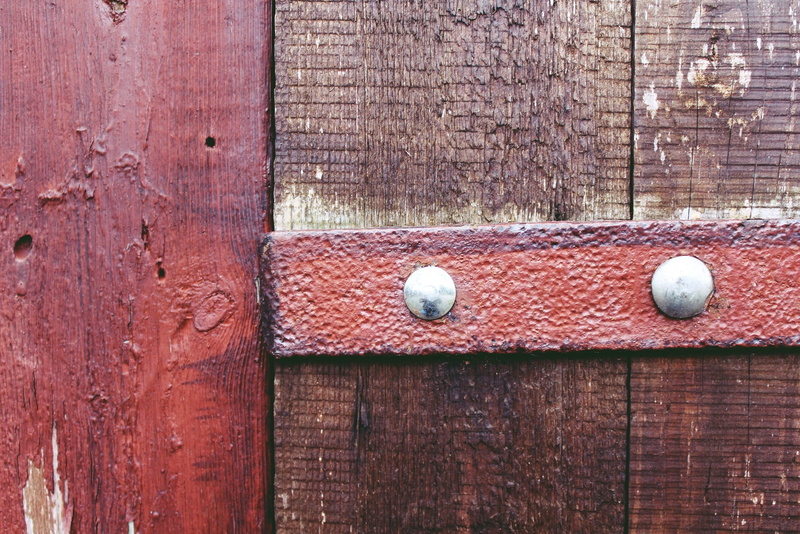 wall - building feature, boards, door, sport, wood, area, brown, structure, barn, wooden boards, close-up, surface, red, wood - material, day, close, input