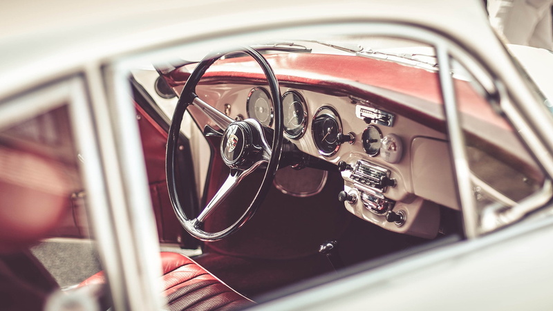 motor vehicle, human hand, vintage car, Porsche, vehicle interior, vehicle, windshield, transportation, control panel, retro styled, mode of transportation