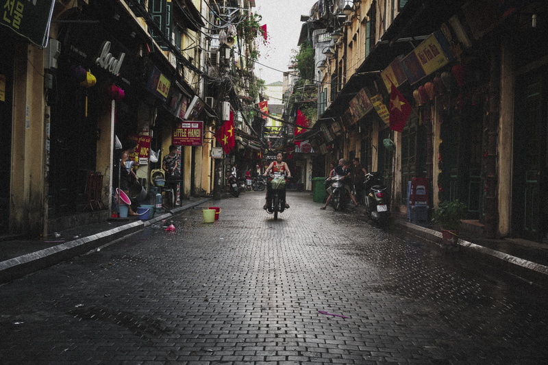 direction, riding, scooter, dark, balance, cobblestone, morning, lifestyles, near, motor, women, daytime, old quarter hanoi, building, vietnam, architecture