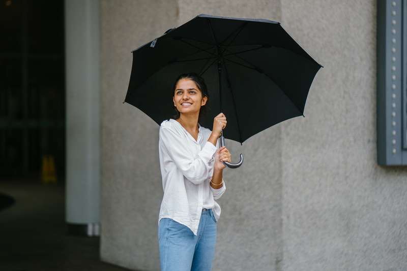 button, white shirt, city, casual, females, jeans, white, beautiful woman, umbrella, casual clothing, cheerful, women, woman, happiness, smile, candid
