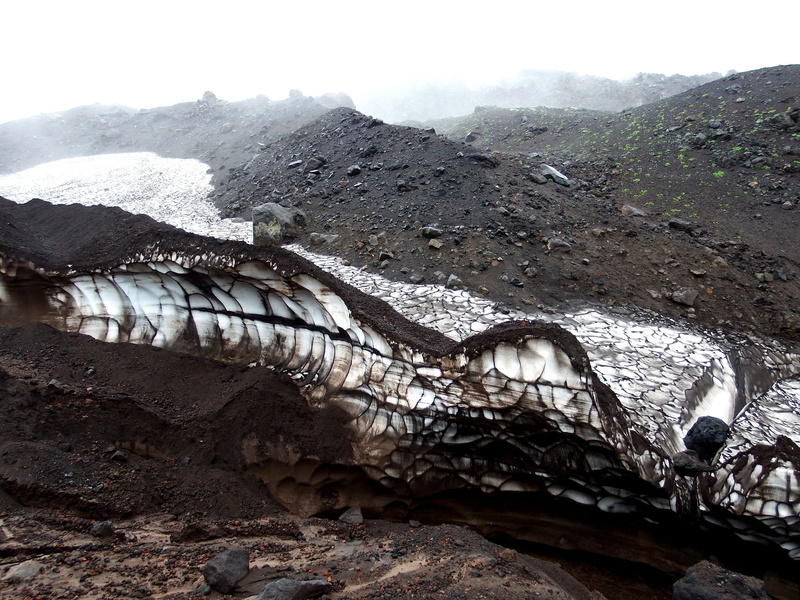 non-urban scene, beauty in nature, rock, ravine, fog, tourism, the foot of the volcano, nature, bad weather, cold temperature, precipitation, no people
