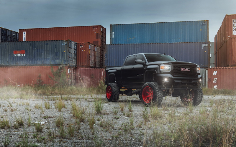 Denali, black, truck, agriculture, cargo container, field, outdoors, land vehicle, day, landscape, land, sky, pickup, building exterior, SUV, architecture