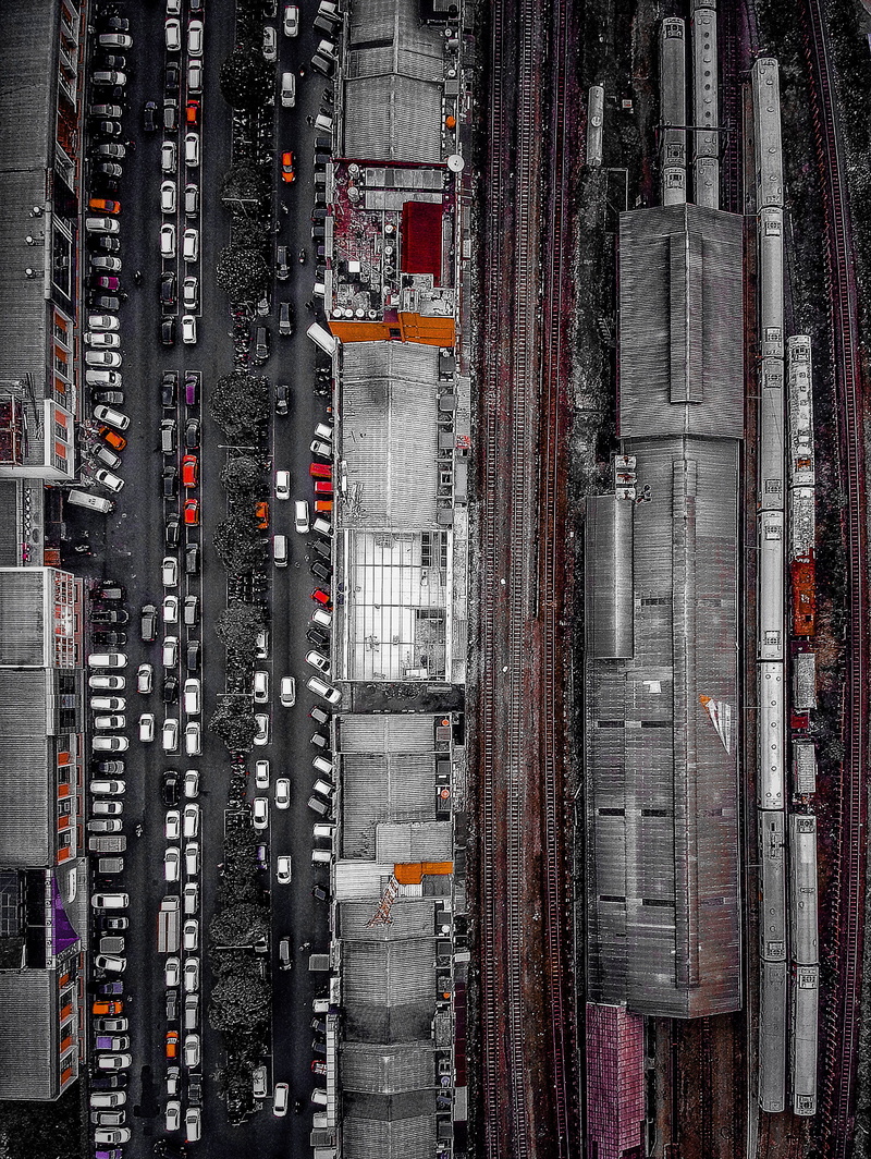black and white, 2K, aerial view, no people, city, architecture, drone view, built structure, full frame, high angle view, office building exterior, traffic