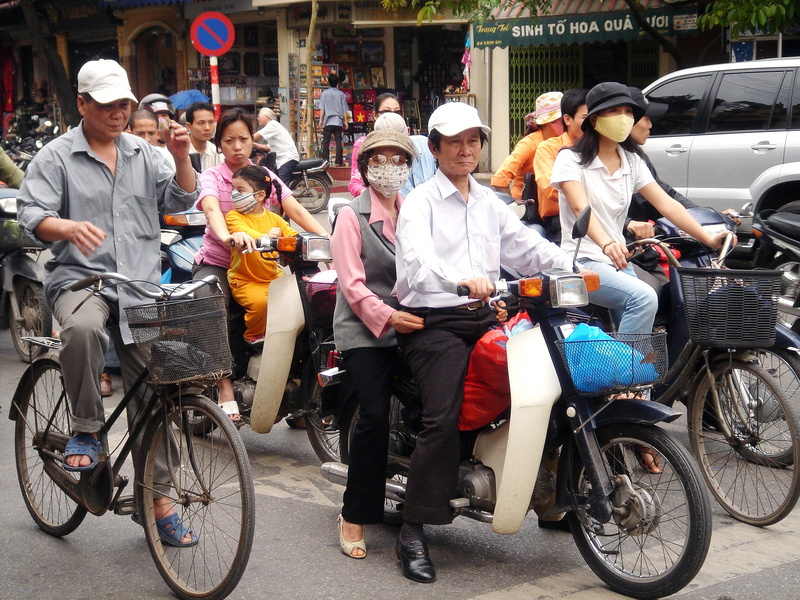real people, males, mode of transportation, vietnam, smiling, daytime, children, travel, crowded, full length, architecture, outdoors, woman, land vehicle