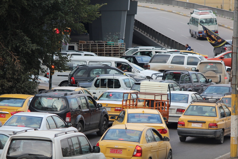 built structure, high angle view, traffic, traffic jam, day, public transportation, baghdad, mode of transportation, travel, commuter, land vehicle, motor vehicle