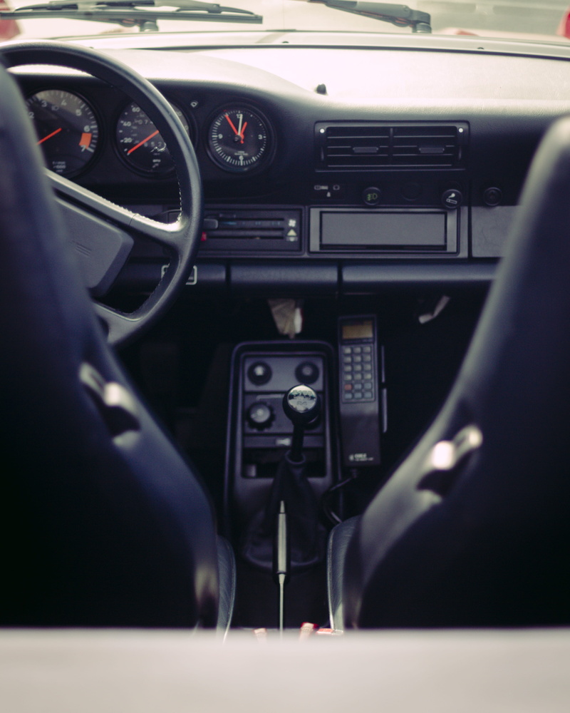 motor vehicle, number, turned, control, car phone, unit, communication, porsche, land vehicle, control panel, manual transmission, stereo, travel, coche