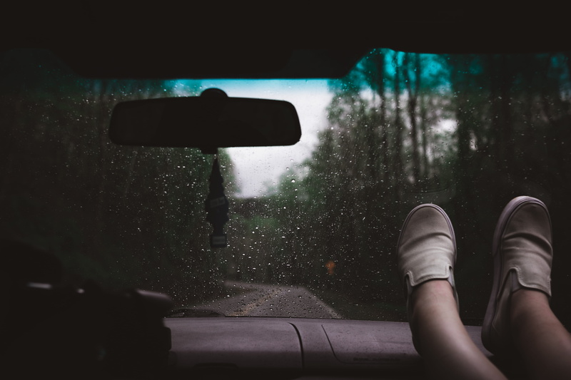 dash, mirror, adult, vehicle, inside, transportation, weather, transport, relax, windscreen, road, fashion, shoe, moody, sitting, style, one Person, foot