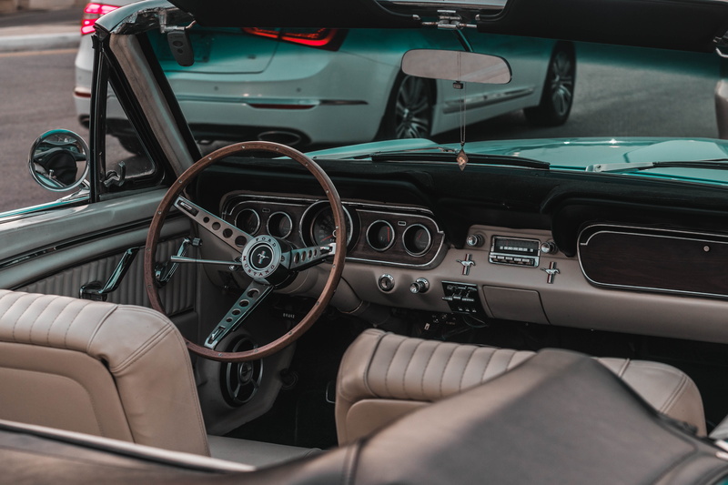 vehicle seat, dashboard, control panel, mode of transportation, old, sedan, window, windscreen, luxury, land vehicle, steering wheel, mustang, control