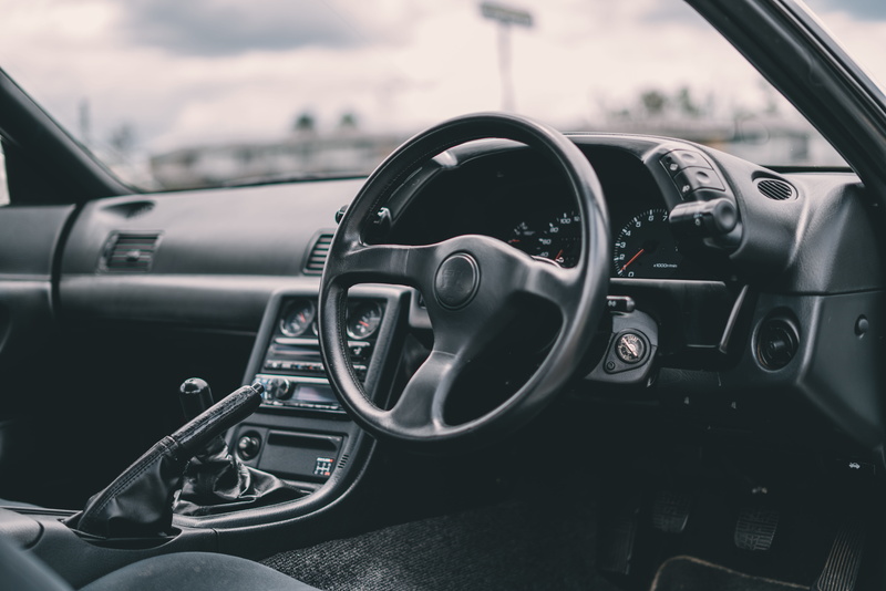 close-up, day, dashboard, outdoors, travel, tarmac, steering, wheel, control, transport, control panel, grayscale, chrome, tachometer, mode of transportation
