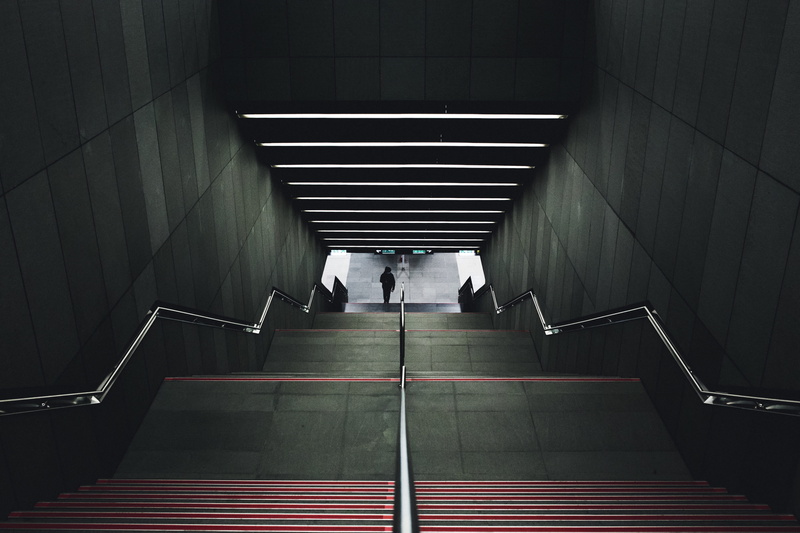 railing, illuminated, architecture, indoors, train, underground, urban, public transportation, subway, stairs, rear view, commute, person, stairwell, travel
