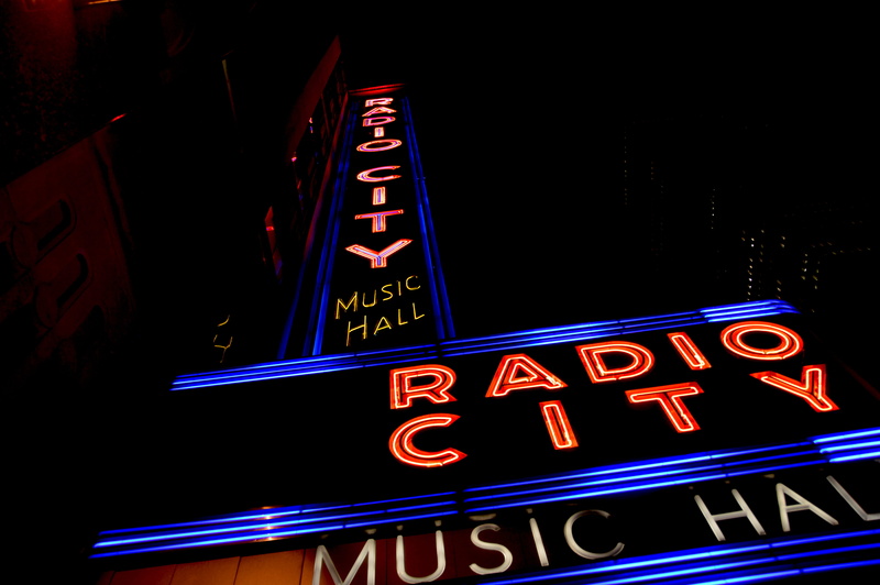 commercial sign, outdoors, low angle view, number, neon, information sign, architecture, advertisement, dark, text, new york, sign, neon sign, information