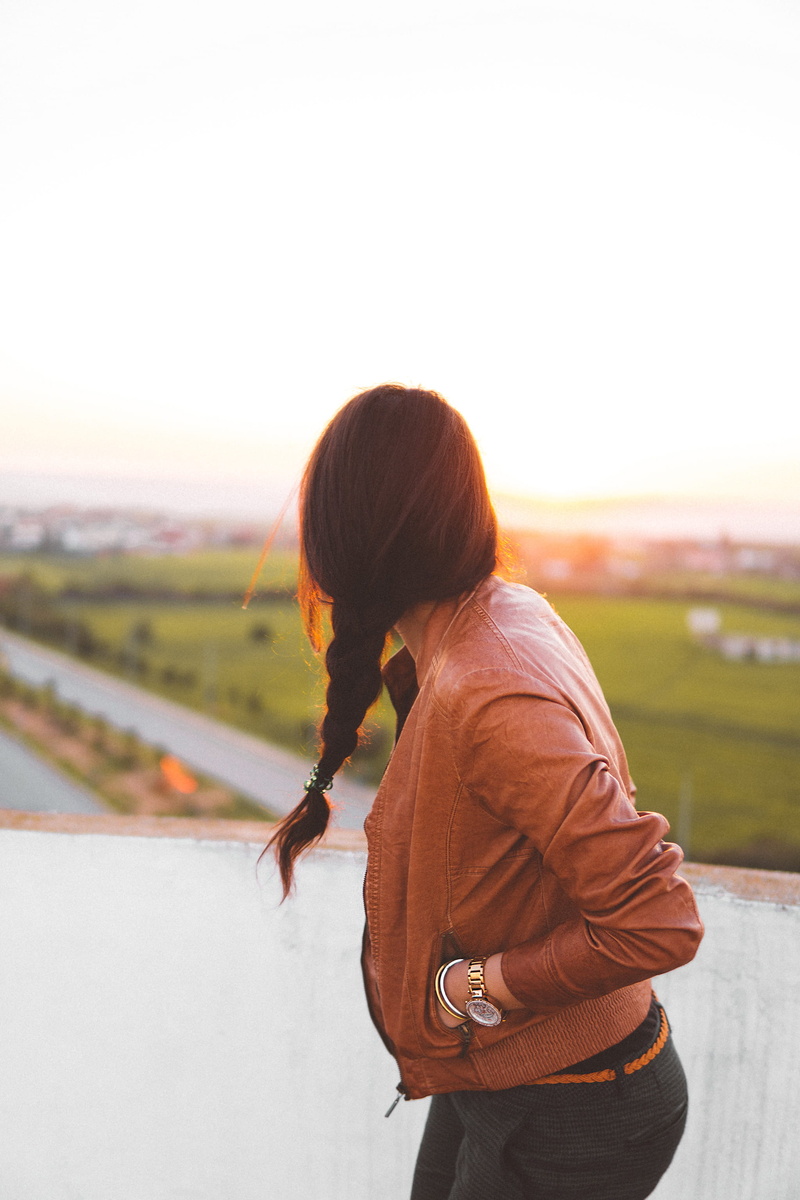 one person, real people, woman, hairstyle, jacket, standing, leisure, nature, braided hair, travel, time, clothing, landscape, brown, lifestyles, girl