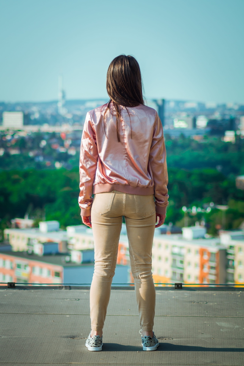 girl, rear view, blurred background, 5K, pink, one person, wearing, city, outdoors, model, young, teen, female, hairstyle, woman, built structure, buildings
