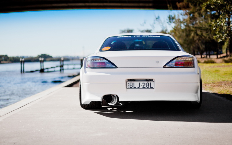 plant, nissan silvia s15, sunlight, motor vehicle, city, transportation, sky, outdoors, day, 2K, road, communication, blue, text, car, no people, mode of transportation