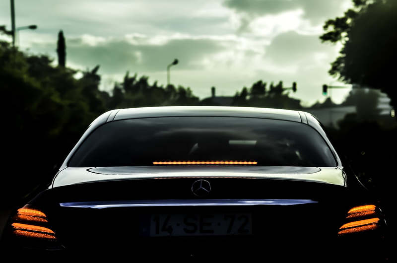 motor vehicle, no people, 4K, luxury, sky, near, black, automotive, automatic, focus on foreground, street, cloud - sky, trees, hood, communication, mode of transportation
