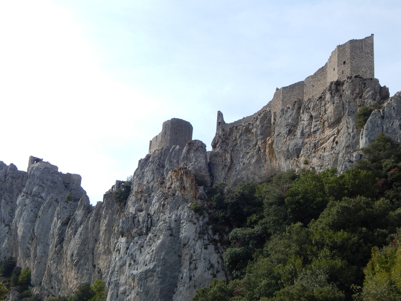 outdoors, tranquil scene, mountain, day, middle ages, beauty in nature, wall, tree, sky, tranquility, france, low angle view, cliff, no people, nature