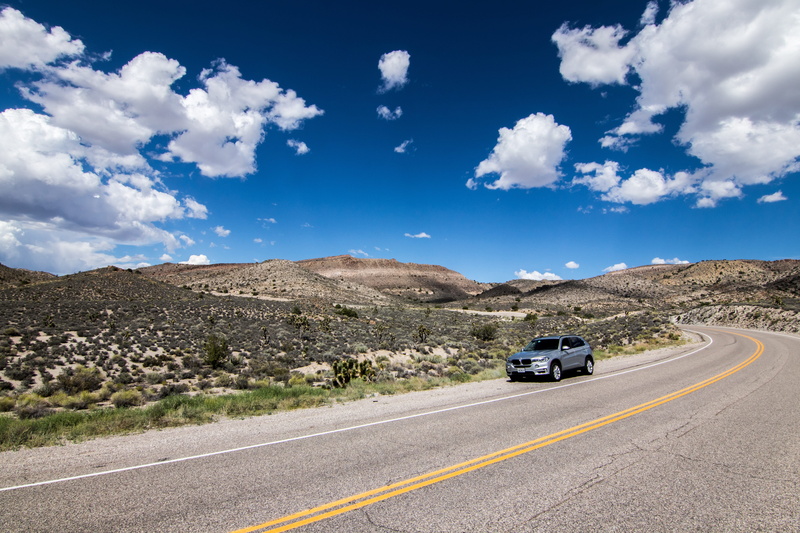 motor vehicle, expensive, clouds, marking, no people, outdoors, mountains, suv, grasses, stylish, passenger cars, mountain, car, dare, shiny, 5K, gloss