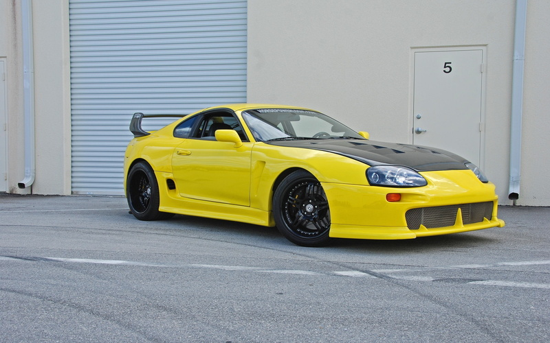building, yellow, Toyota Supra, taxi, stationary, car, motor vehicle, city, building exterior, 2K, architecture, tuning, street, no people, yellow cars