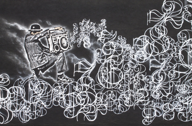 text, playing, art and craft, western script, black background, science, background, indoors, musical numbers, craft, artistic, mural, studio shot, biology