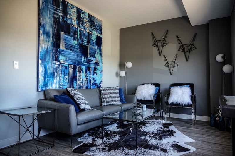 indoors, pillow, flooring, blue, table, blue painting, living room, chair, modern, abstract wall hangings, home, luxury, light blue, seat, sofa, domestic room
